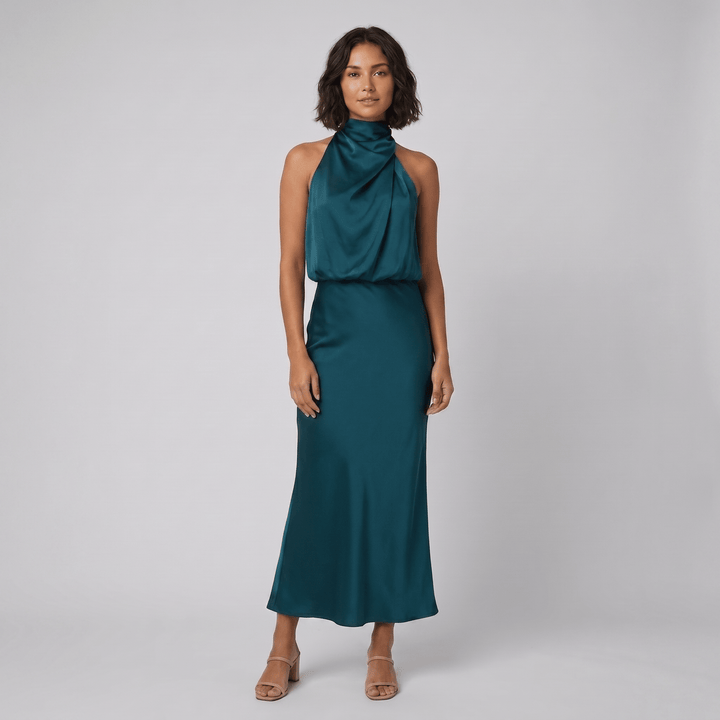 Ombline floor-length satin halter gown in pine blue, on model