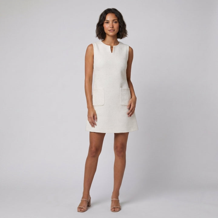 Orla white textured A-line mini dress with buckle, front on model