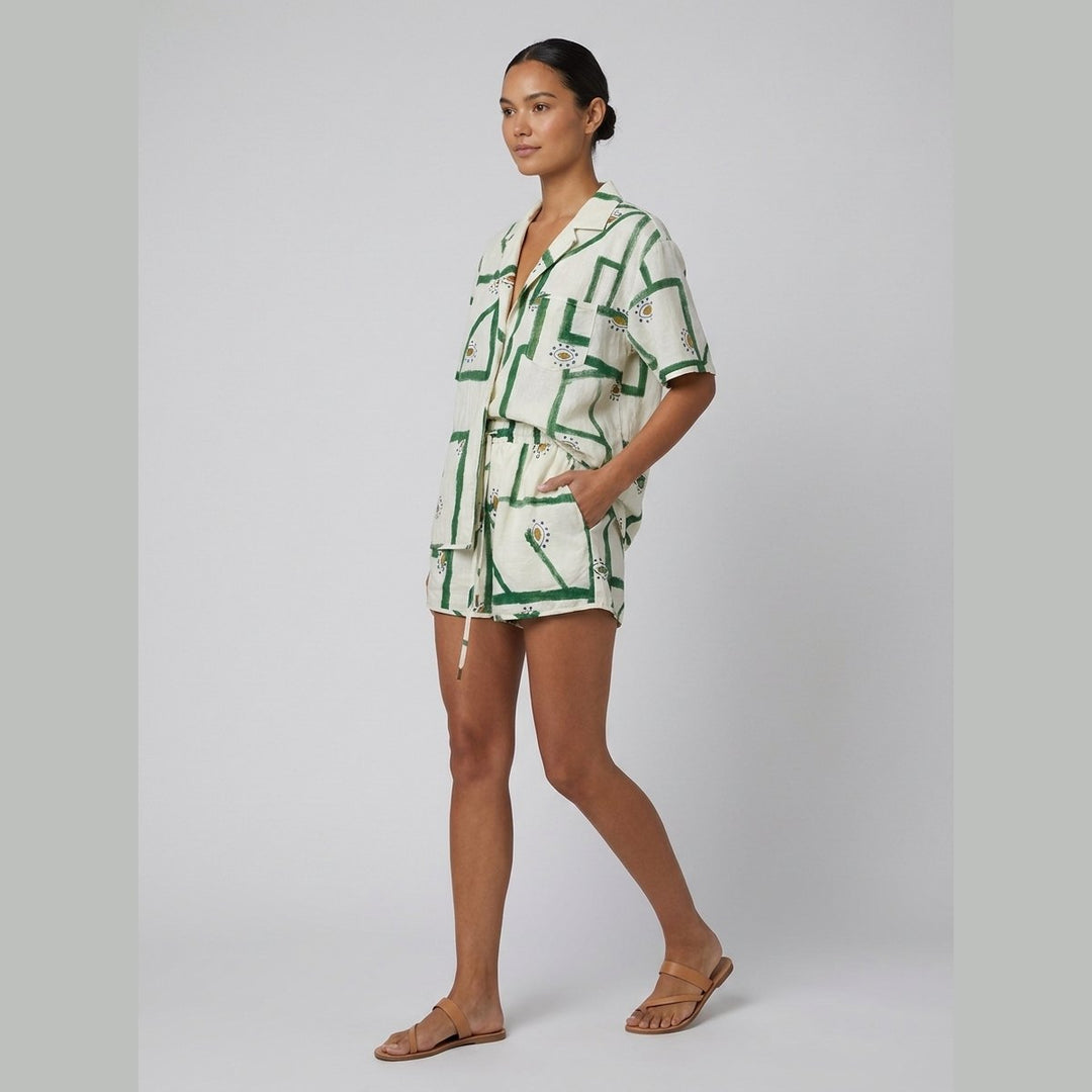 Pine off-white linen shorts set side view on model