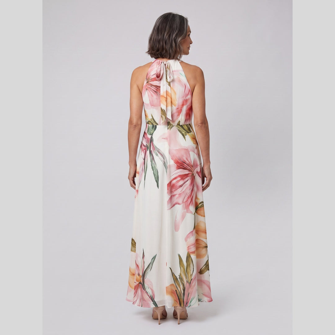 Back view of the white floral halter neck maxi gown - The store Vancouver