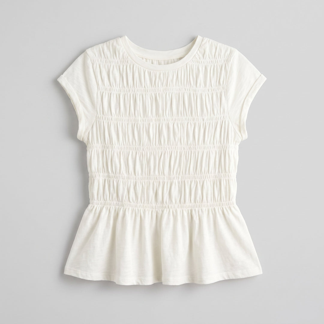 Rita ruffle top, folded flat-lay product photo