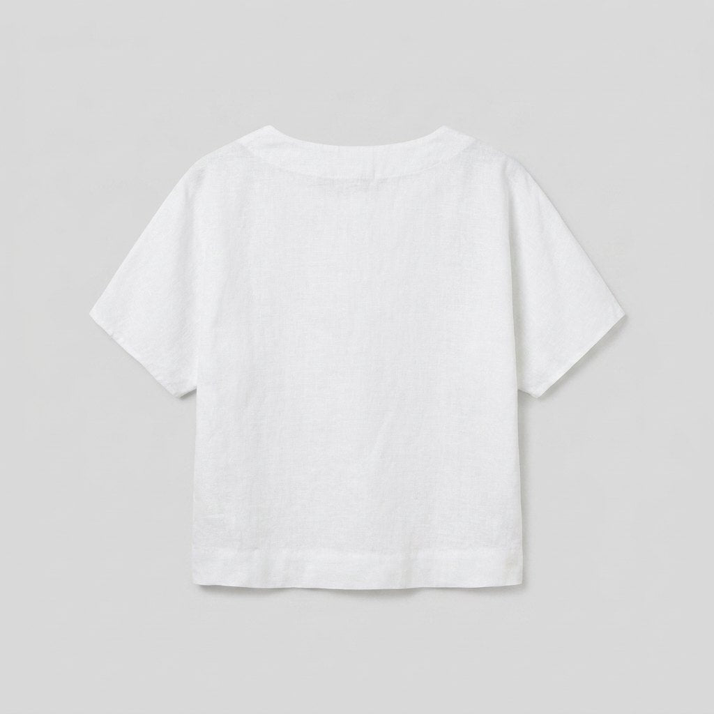 White linen top, back view flat-lay