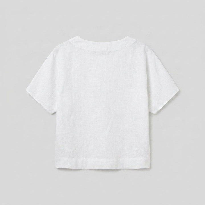 White linen top, back view flat-lay