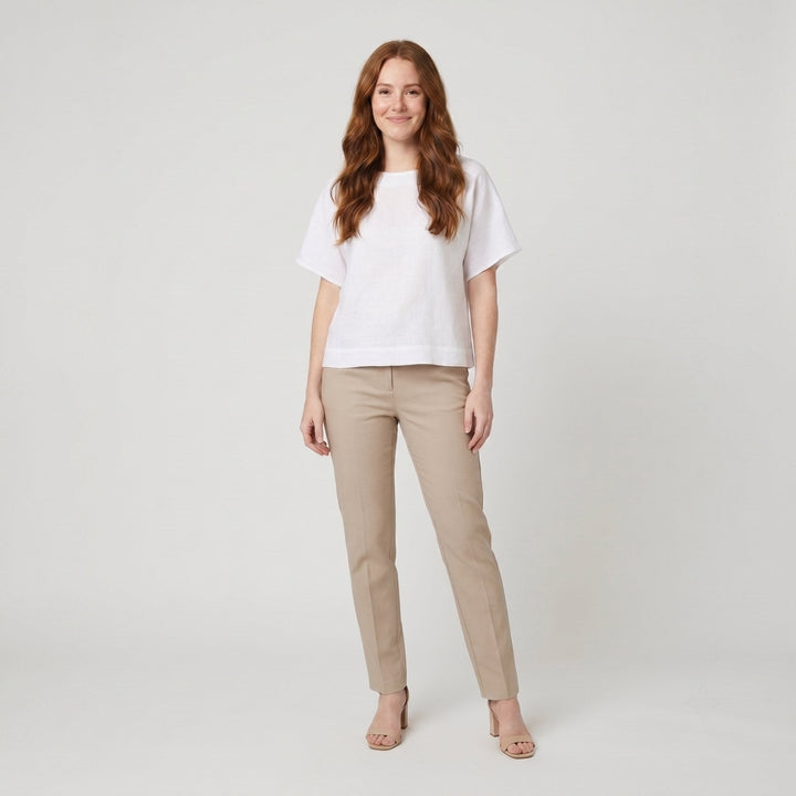 White loose-fit linen top with round neck, front view on model