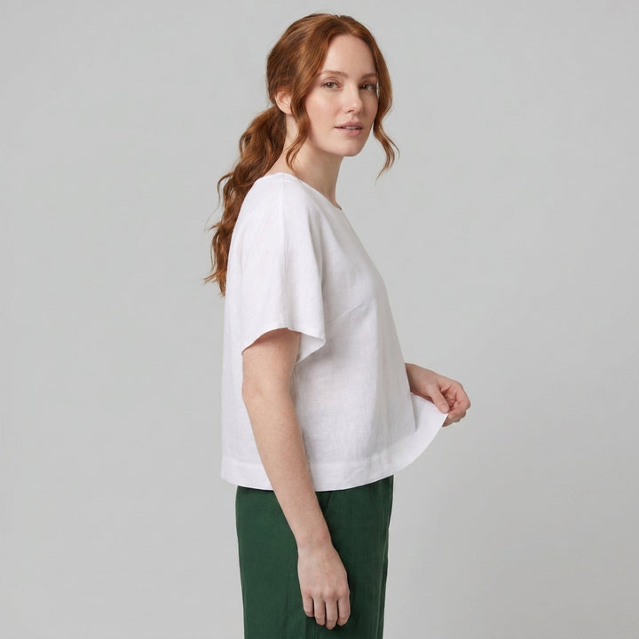White linen top with short sleeves, side view on model