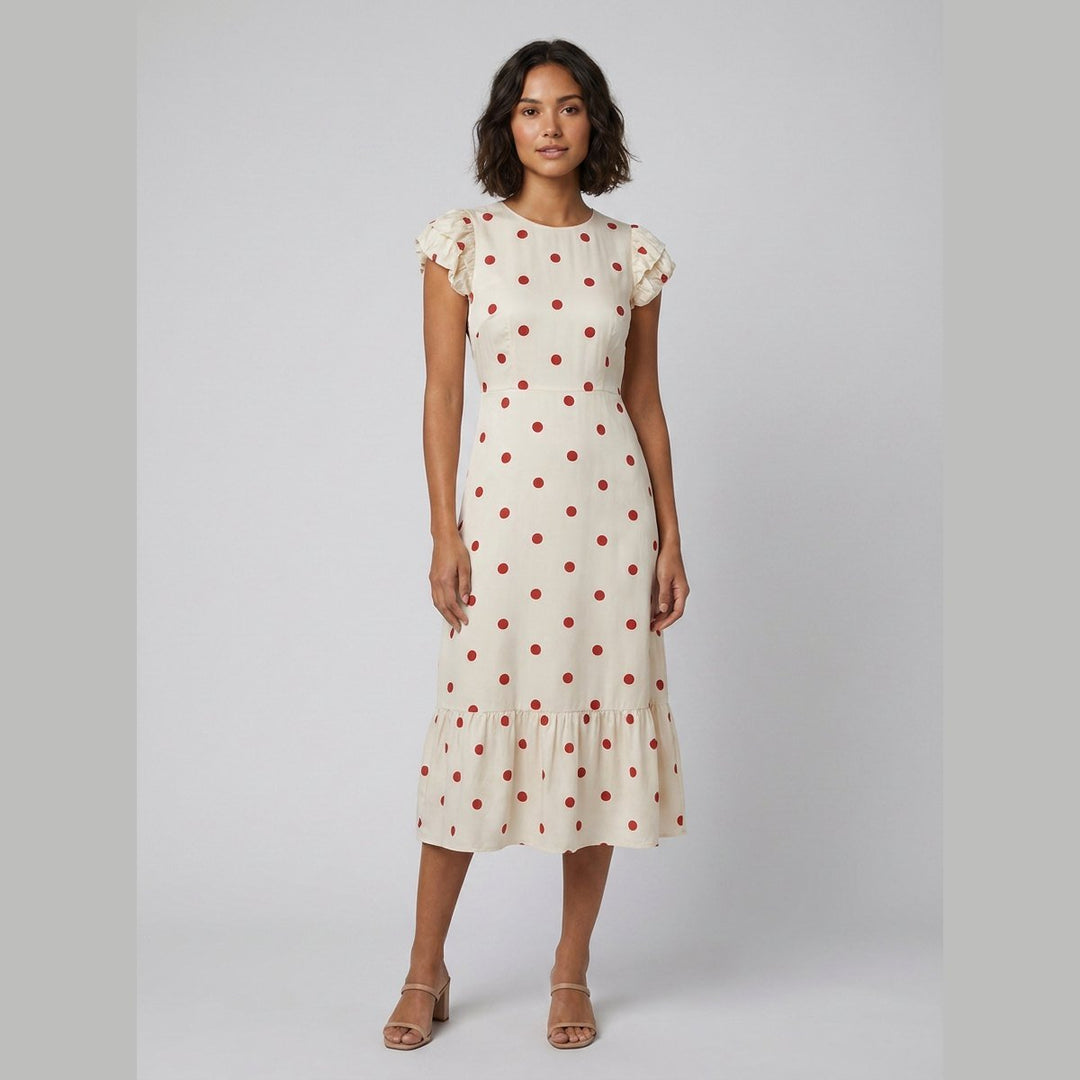 Sybille ivory and red polka dot midi dress front on model