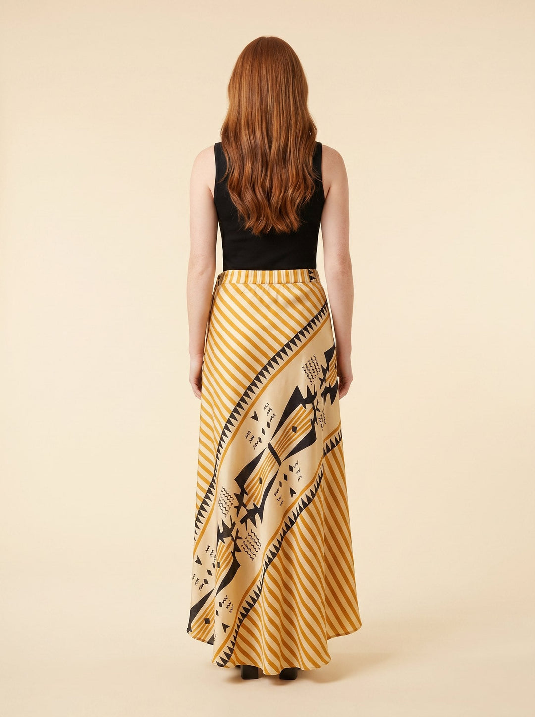 Satin maxi skirt seen from behind, showing the elastic waist