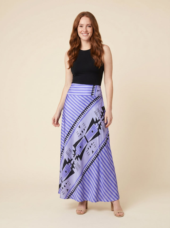 Blue satin maxi skirt with geometric print, front view on model