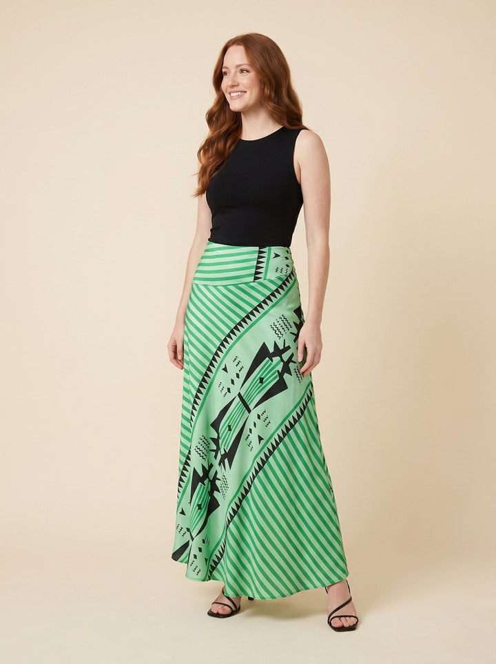 Green satin maxi skirt with geometric print, front view on model