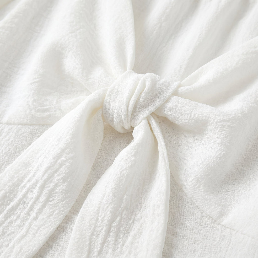 Vera V-neck mini dress textured fabric bow detail