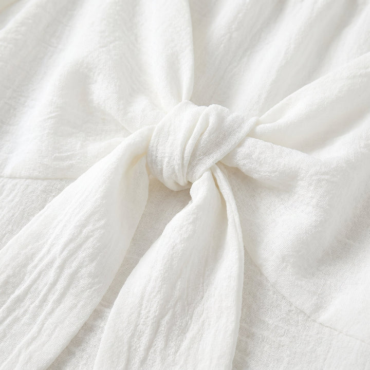 Vera V-neck mini dress textured fabric bow detail