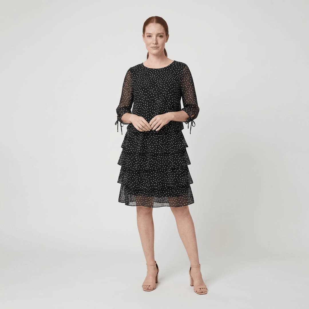 Victoire black polka dot dress with a layered skirt, front view